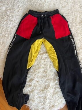 I AM GIA Black Joggers with Red Pockets and Yellow Trim